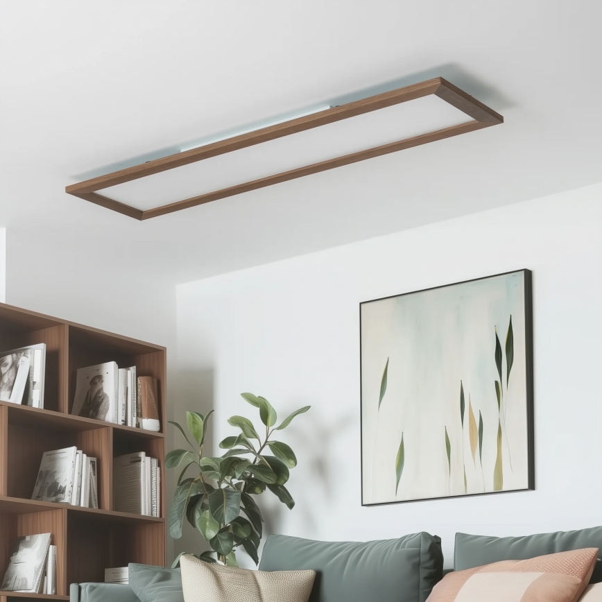 Dlhý obdĺžnikový LED panel s hnedým dreveným rámom je umiestnený na bielom pozadí. Panel svieti.