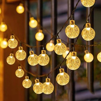 LED solárna dekoračná svetelná reťaz 50× LED / 8 režimov, 500 mAh, 9,5 m, IP67, teplá biela