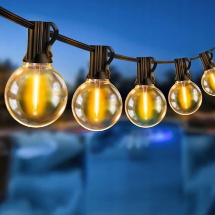 LED stmievateľný vonkajší dekoratívny svetelný reťazec 25xE12/1W/24/230V 17,5 m IP65 čierny + diaľkové ovládanie