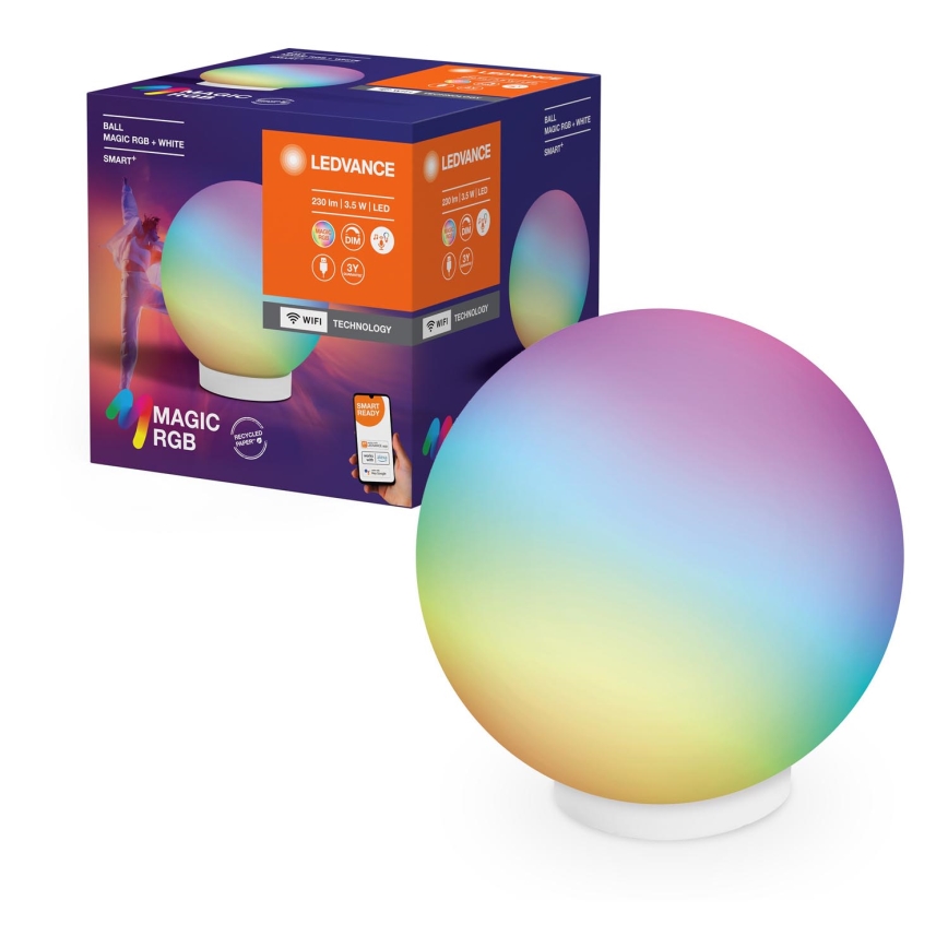Svietidlo LEDvance Magic RGB, guľového tvaru, svieti viacfarebne. Je umiestnené na bielom podstavci, vedľa balenia s popisom: 230 lm / 3,5 W LED, Wi-Fi technológia, Magic RGB a Smart Ready.