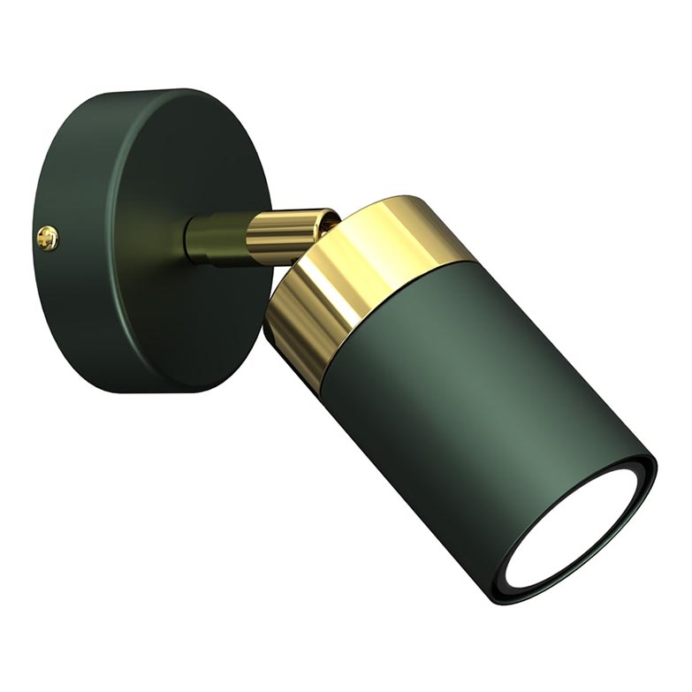 Svietidlo so zeleným valcovým tienidlom a zlatým lemom je pripevnené na stenu. Svietidlo smeruje doprava a vyžaruje svetlo. Biela stena tvorí pozadie.