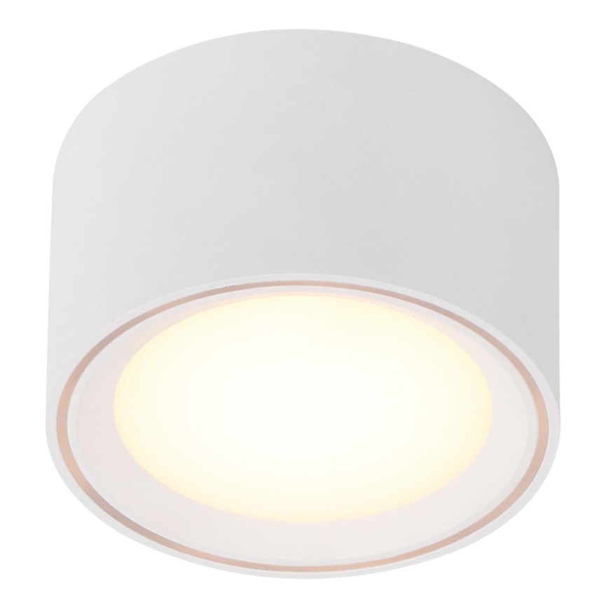 Biela valcová nástenná lampa svieti. Svetlo vyžaruje z vnútorného kruhového otvoru. Lampa je umiestnená na bielom pozadí.