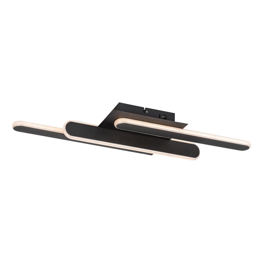 Svietidlo s dvoma predĺženými oválnymi časťami s LED osvetlením je pripevnené k štvorcovej základni. Svietidlo je čiernej farby s krémovým podsvietením. Základňa obsahuje vypínač.