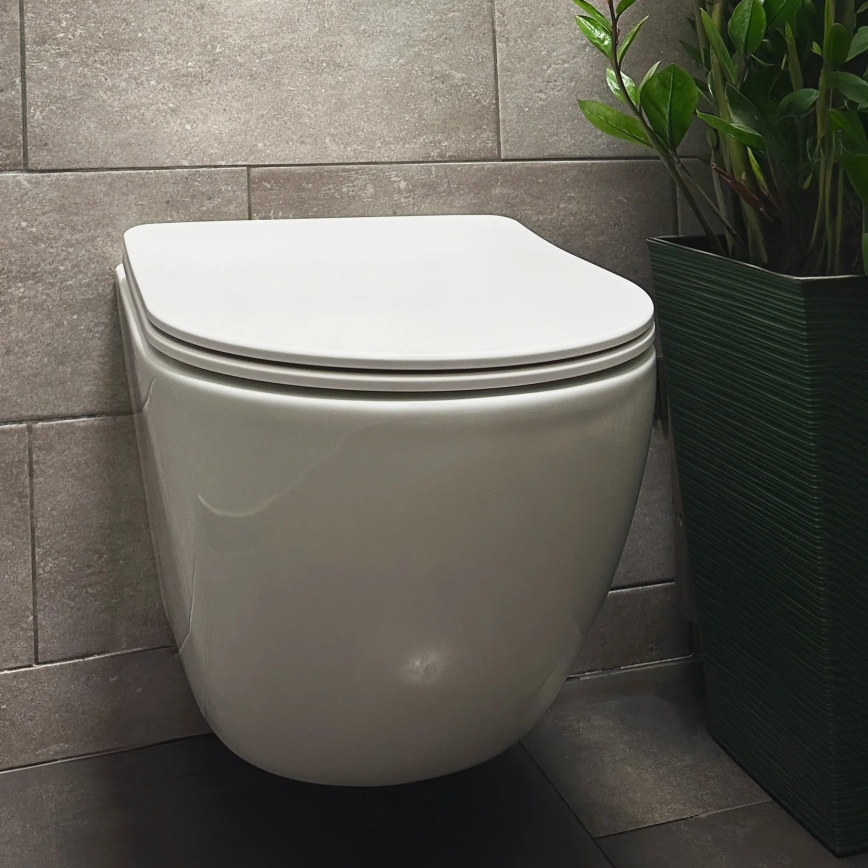 REA-C1259 - Závesné WC s WC sedátkom CARLO MINI TORNADO RIMLESS keramika/lesklá biela