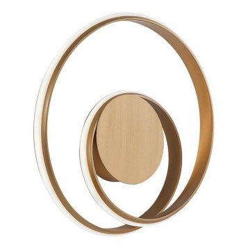 Nástené svietidlo s dvoma prekrývajúcimi sa zlatými kruhmi, vnútorný kruh je plný, vonkajší je prstencový s vnútorným osvetlením. Svietidlo je umiestnené na bielom pozadí.