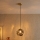 Závesný luster na lanku CRISTAL 1xE14/15W/230V mosadz/dymovo čierna